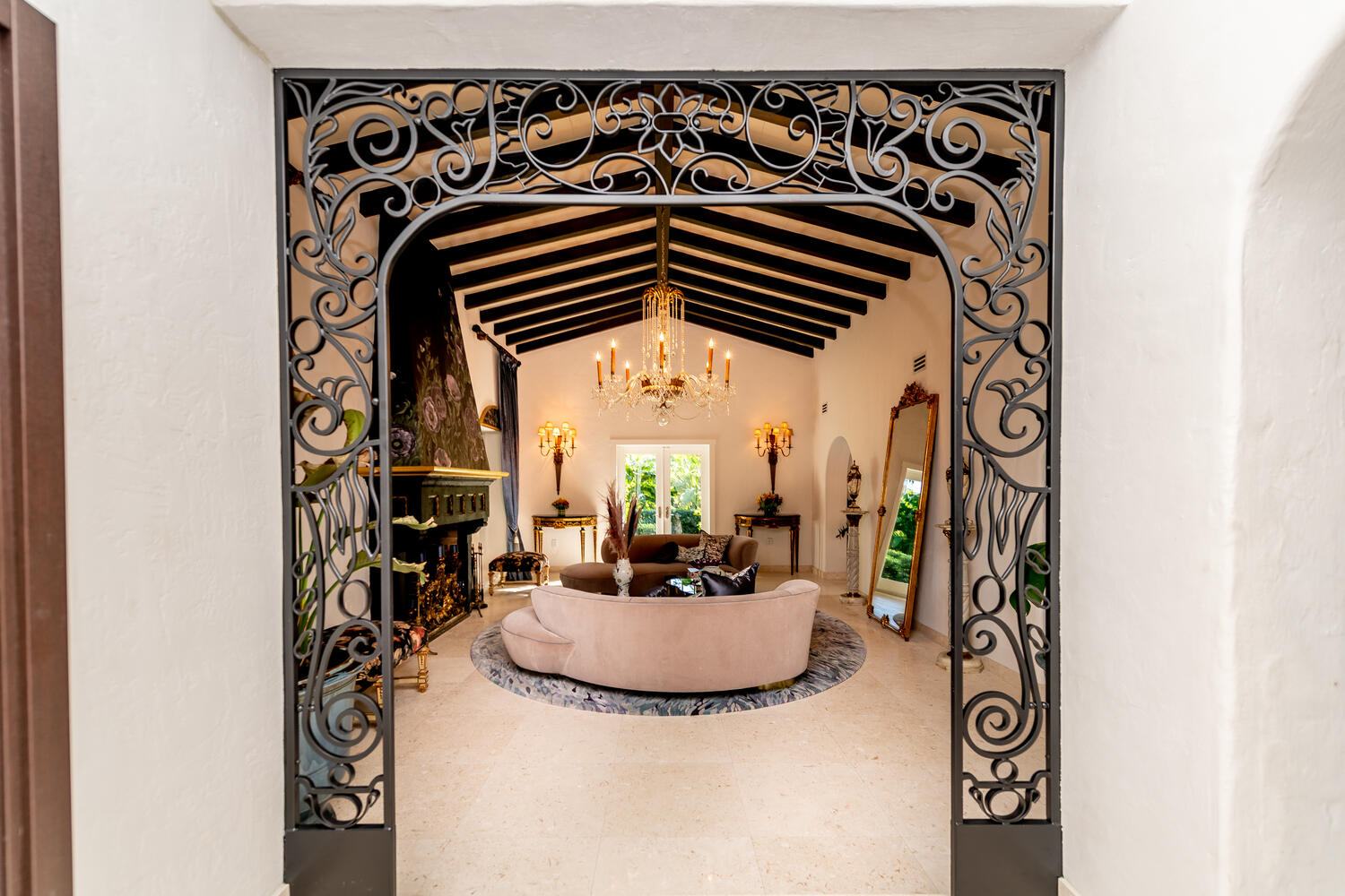 Wrought-iron archway opening onto a living room