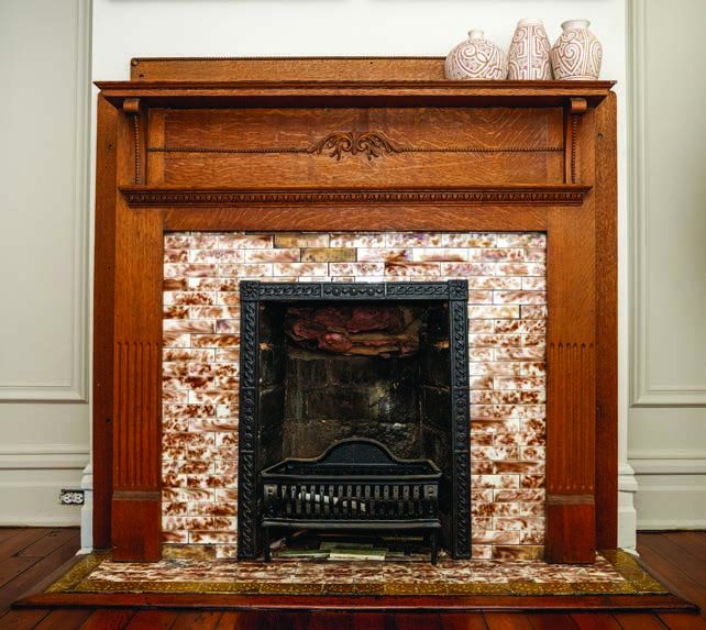 An original fireplace in the parlor.