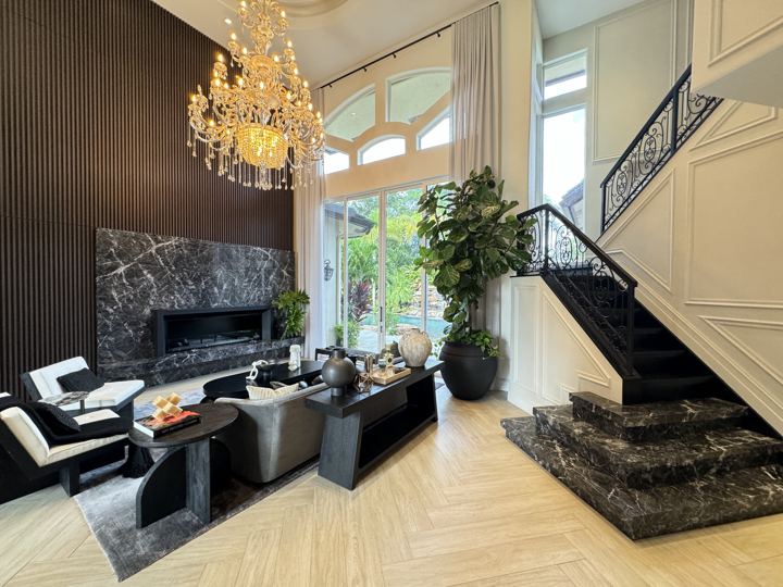 Double-height living room with crystal chandelier and marble stair, Parkland Residence II